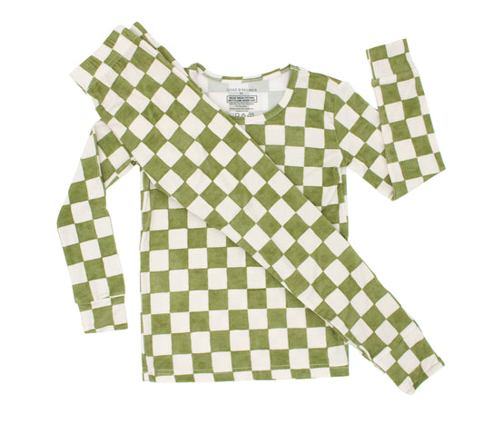 Orchard Checkered toddler bamboo pajamas in a soft olive green and ivory checkered print, shown in a flat lay.