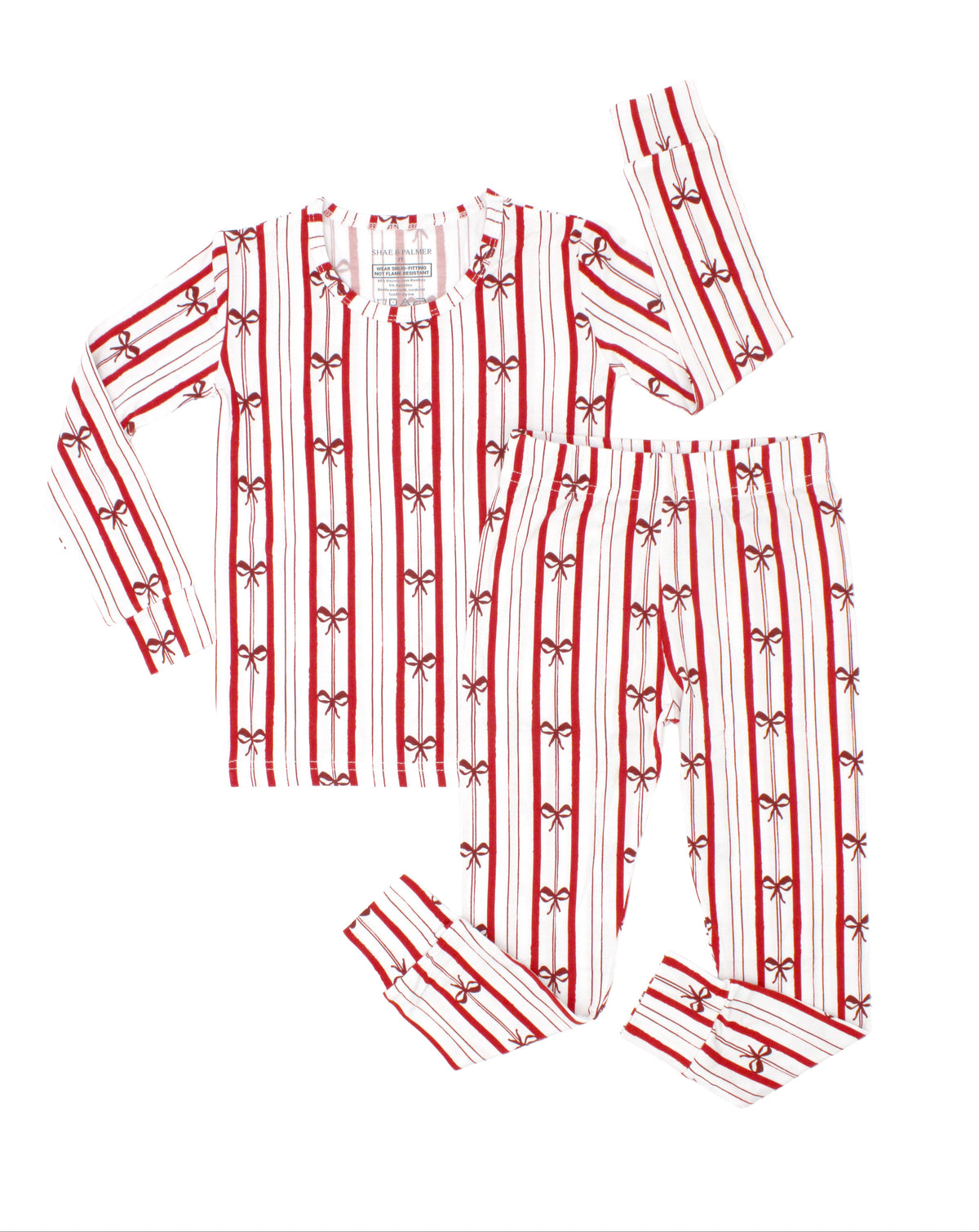 Ribbon Stripe bamboo big kids pajamas by Shae & Palmer featuring timeless red and ivory stripes with delicate bows. Comfortable, breathable Christmas pajamas for big kids, perfect for matching family holiday pajamas, coordinating sibling sleepwear, Christmas morning traditions, and festive holiday photos.