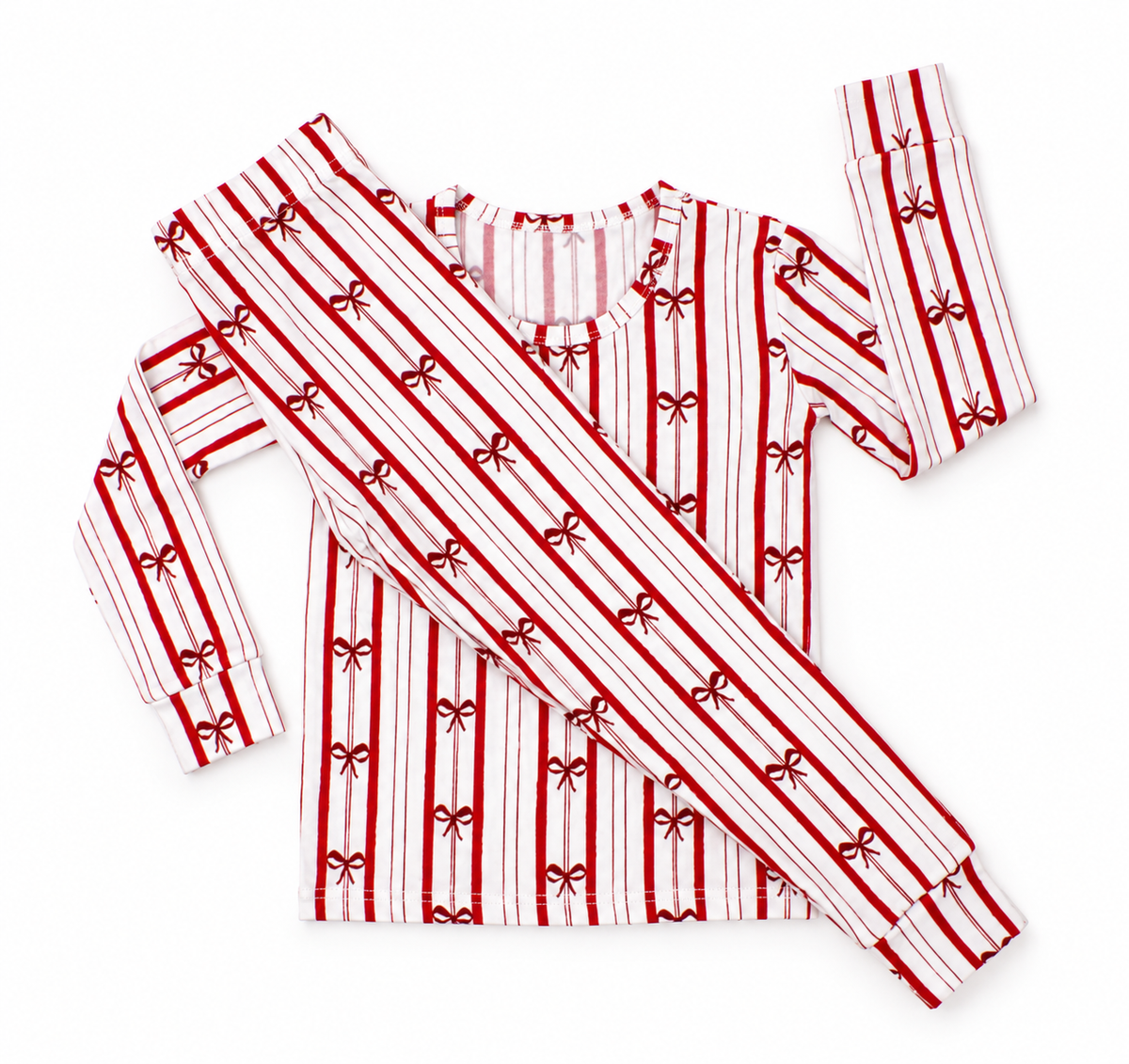 Ribbon Stripe bamboo toddler pajamas by Shae & Palmer featuring classic red and ivory stripes with delicate bows. Soft, breathable Christmas toddler pajamas perfect for matching family holiday pajama sets, Christmas morning, festive family photos, and cozy winter nights.
