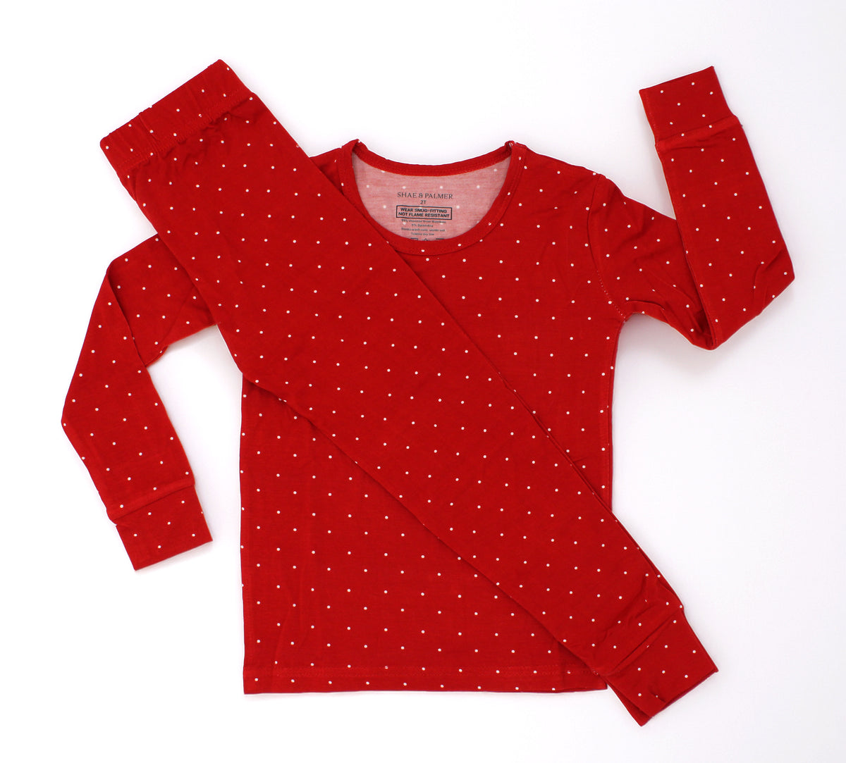 Ruby Dot Christmas toddler bamboo pajamas by Shae & Palmer featuring a delicate red dot holiday print on buttery-soft, breathable bamboo fabric. Festive red Christmas pajamas for toddlers, perfect for a matching family pajama set, Christmas morning traditions, holiday family photos, and cozy winter nights.
