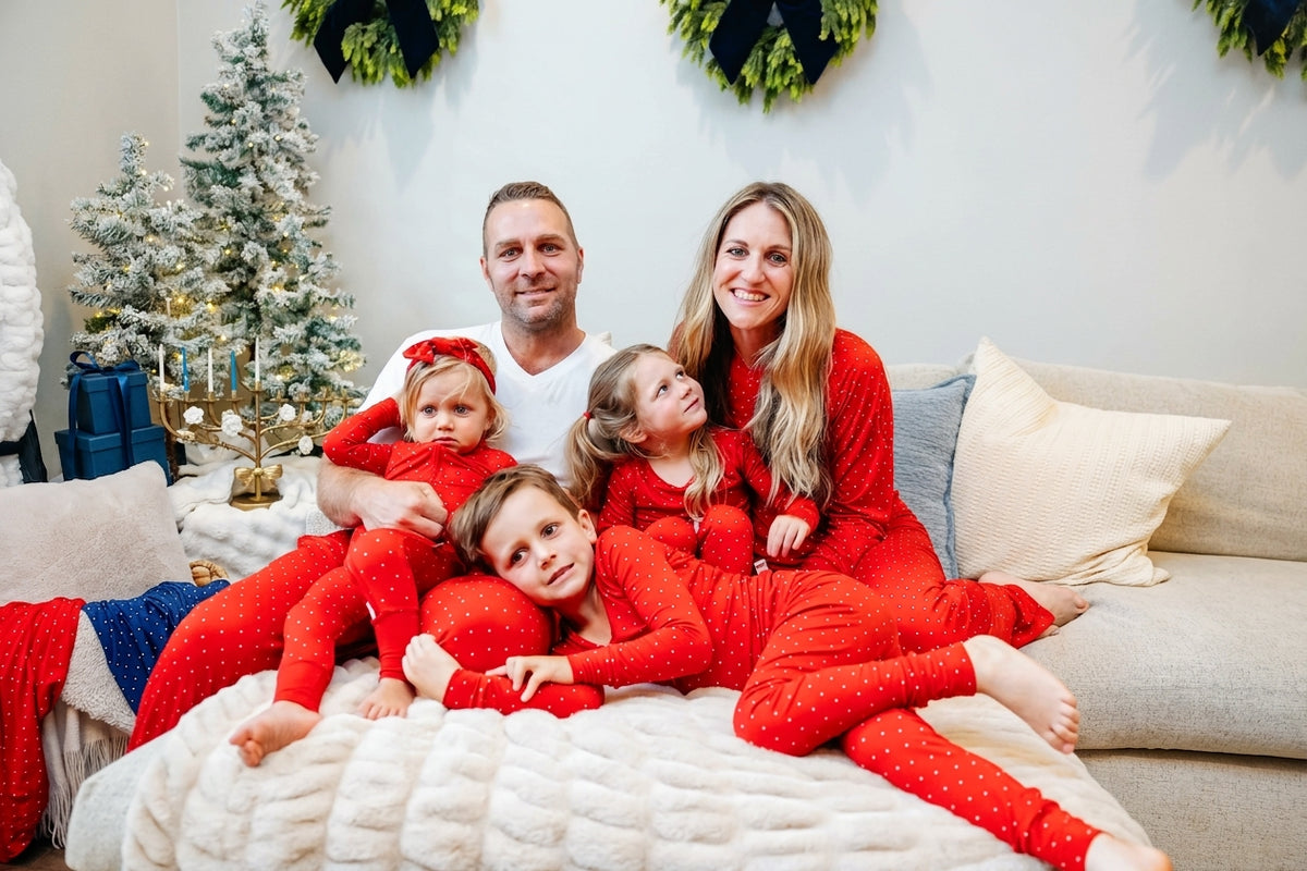 Ruby Dot matching family Christmas pajamas by Shae & Palmer featuring red polka dots on soft bamboo fabric. Coordinating baby pajamas perfect for Christmas morning, holiday family photos, and cozy family moments.