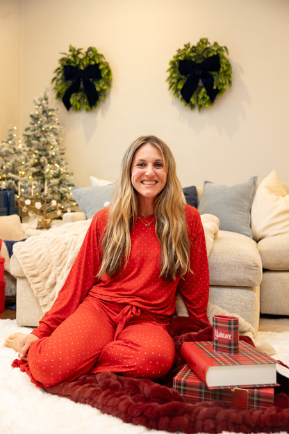 Mom wearing Ruby Dot women's bamboo pajamas by Shae & Palmer, featuring a classic red polka dot print. Soft, breathable Christmas sleepwear designed for cozy nights and matching family holiday moments.