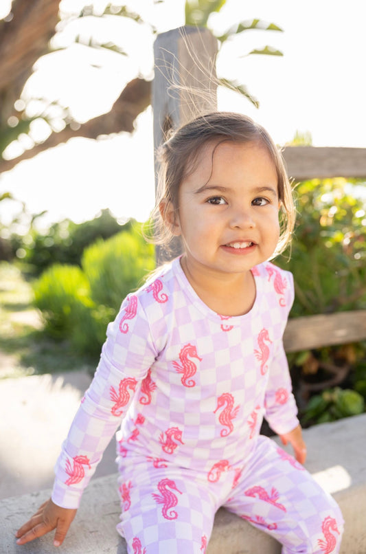 Soft bamboo toddler pajamas in Seahorse Splash print highlighting breathable and stretchy fabric texture