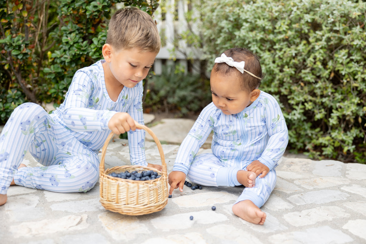 Blueberry Lane bamboo pajamas for kids and baby in blue striped print with blueberry pattern