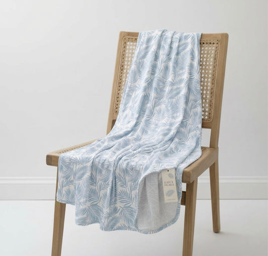 Shae & Palmer Cali Coastal Baby Blue bamboo baby blanket featuring soft blue palm leaf print, lightweight breathable bamboo swaddle blanket for babies and toddlers