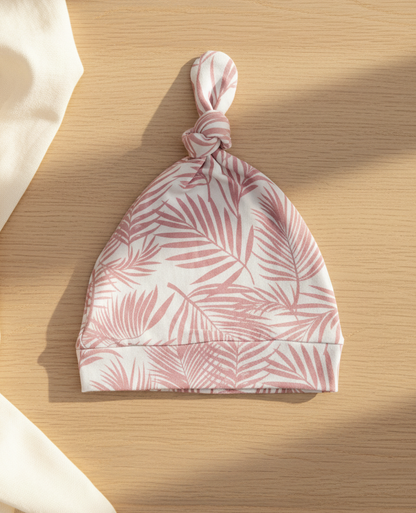 Close-up of Shae & Palmer Cali Coastal Pink bamboo baby hat showing soft breathable bamboo fabric and coastal palm leaf design