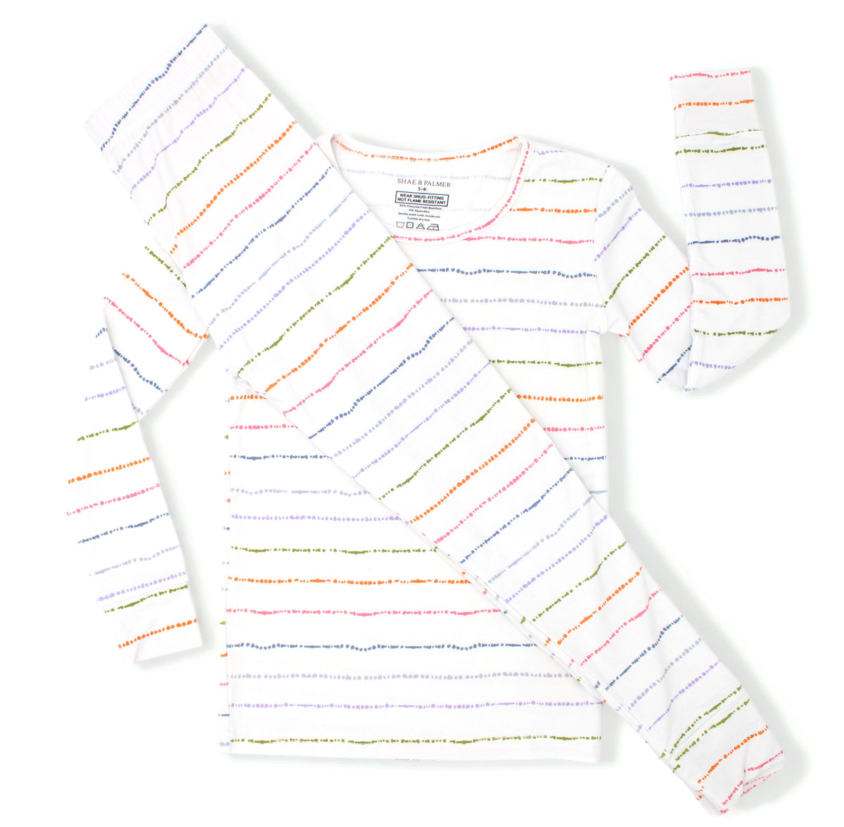 Confetti Stripe bamboo toddler pajamas with colorful hand-painted stripes styled in a flat lay