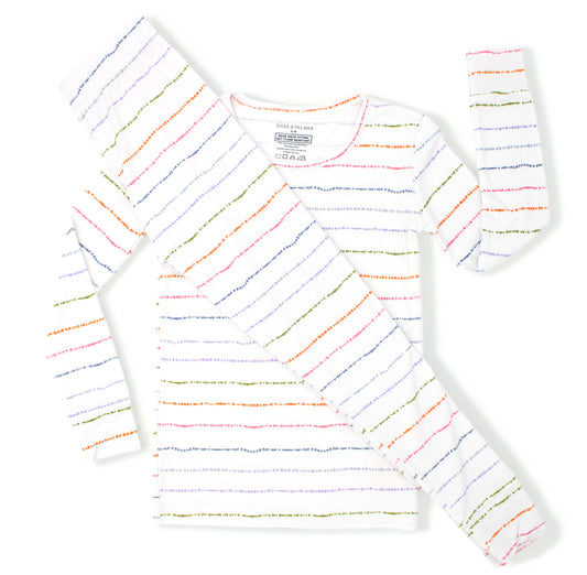 Confetti Stripe bamboo toddler pajamas with colorful hand-painted stripes styled in a flat lay