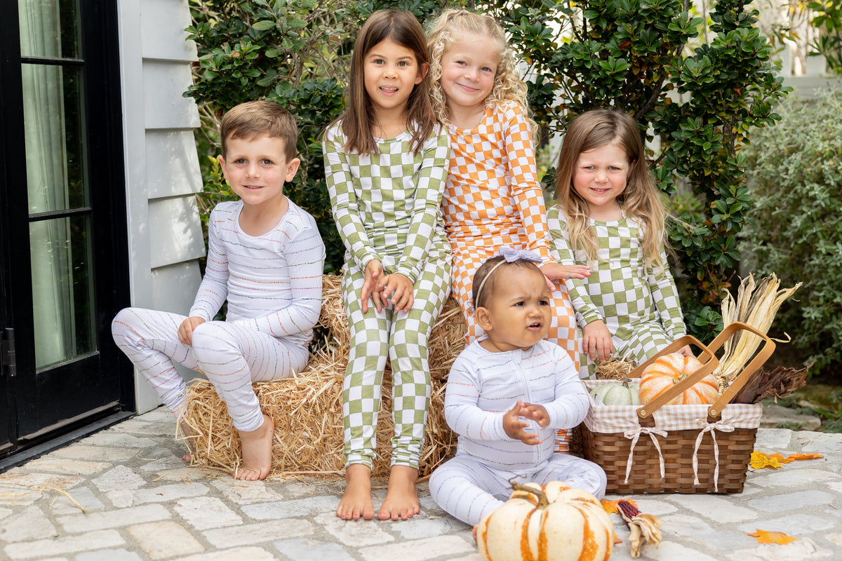 Shae & Palmer fall collection featuring colorful bamboo baby pajamas in a cozy fall lifestyle setting