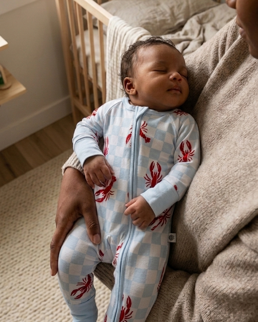 Kids wearing Lobster Splash bamboo pajamas by Shae & Palmer in a playful ocean-inspired print, ultra-soft, breathable, and temperature-regulating sleepwear for toddlers and big kids