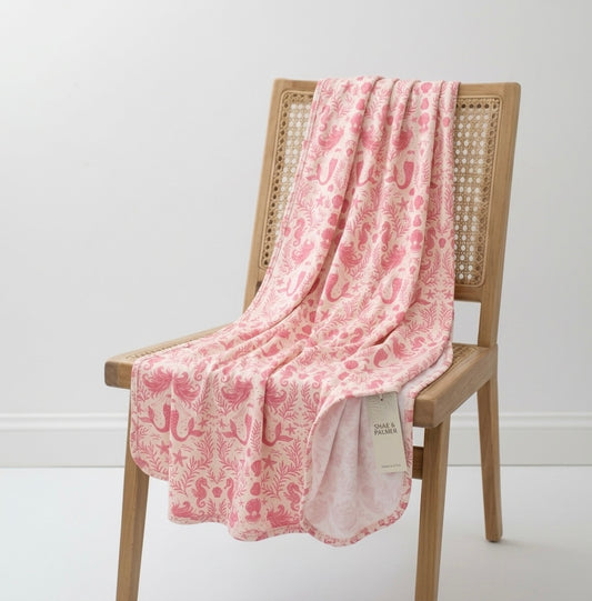 Shae & Palmer Mermaid Cove bamboo baby blanket featuring an ocean-inspired mermaid and seashell print in soft coastal tones.