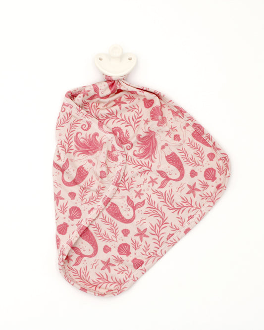 Shae & Palmer Mermaid Cove bamboo baby lovey with pacifier holder featuring whimsical mermaids and seashells in soft coastal tones.
