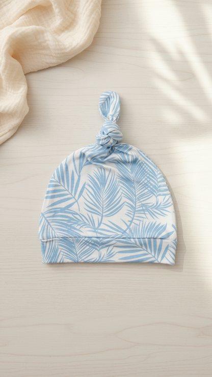 Ultra soft bamboo baby hat in baby blue palm leaf print from Shae & Palmer Cali Coastal collection, cozy breathable newborn essential