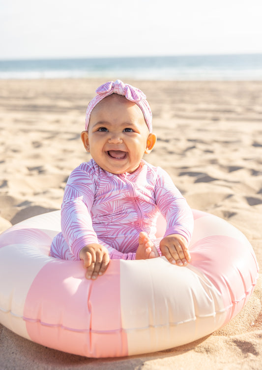Pink Cali Coastal bamboo baby romper by Shae & Palmer featuring a soft coastal palm leaf print with double zippers and buttery-soft bamboo fabric.