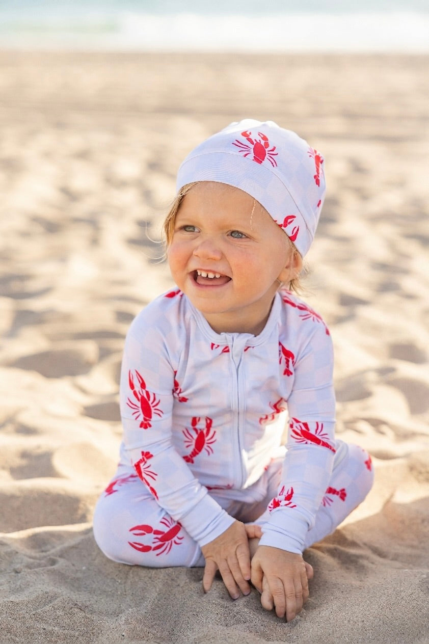 Lobster Splash bamboo baby romper by Shae & Palmer featuring a playful lobster print on soft blue check with double zippers and buttery-soft bamboo fabric.