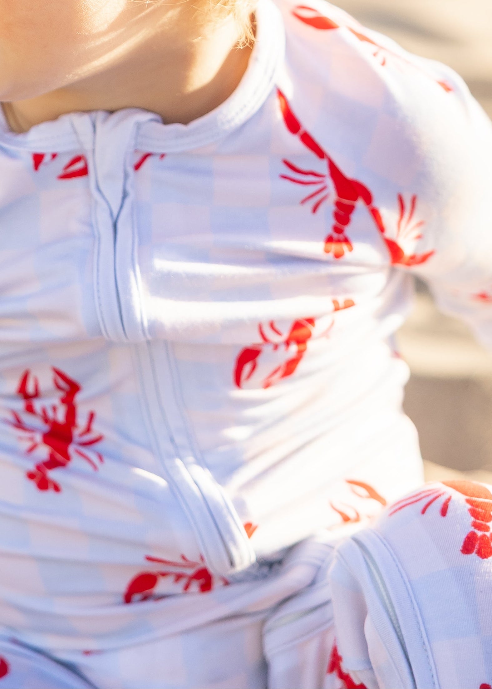 Baby bamboo zipper romper in the Lobster Splash print by Shae & Palmer with a coastal lobster design, double zipper closure, and breathable bamboo fabric.