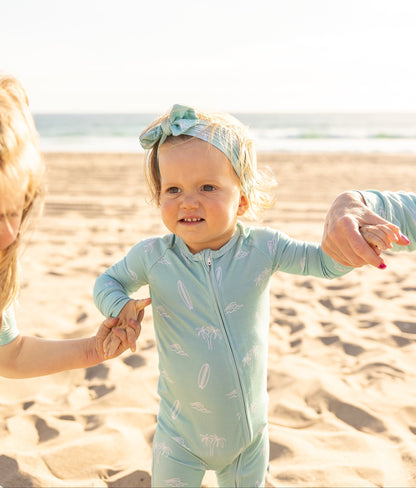 Baby bamboo zipper romper in the Surfside Dream print by Shae & Palmer designed with breathable, temperature-regulating bamboo fabric for sleep and play.
