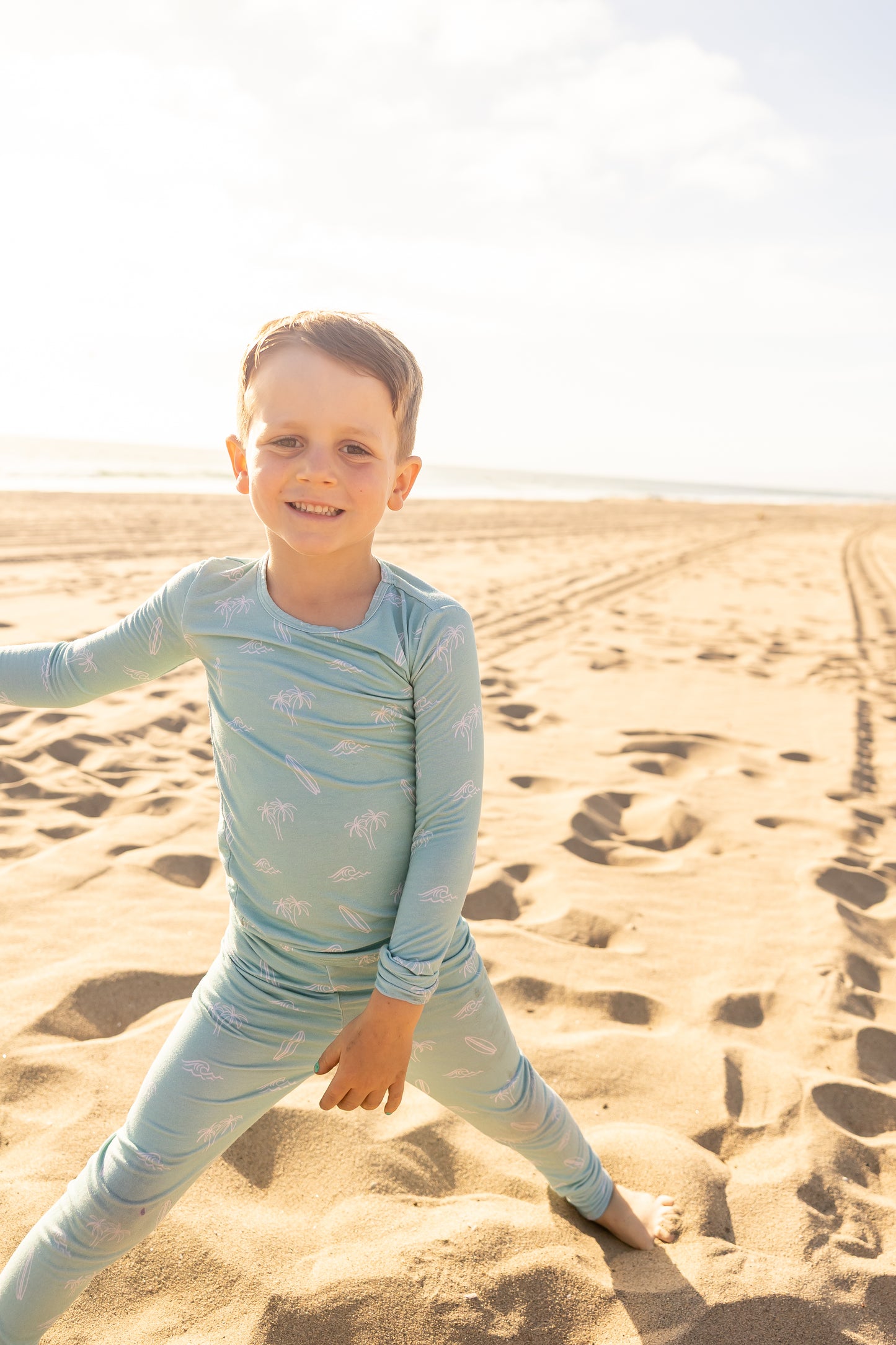 Surfside Dreams big kids bamboo pajama set by Shae & Palmer featuring surfboards, palm trees, and ocean-inspired details in soft seafoam hues.
