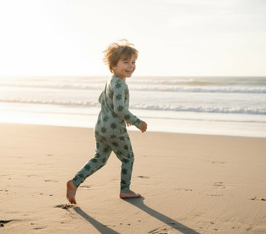Big kid wearing Starry Night Evergreen bamboo pajamas by Shae & Palmer, ultra-soft and breathable two-piece set in a deep green tone, gentle on skin