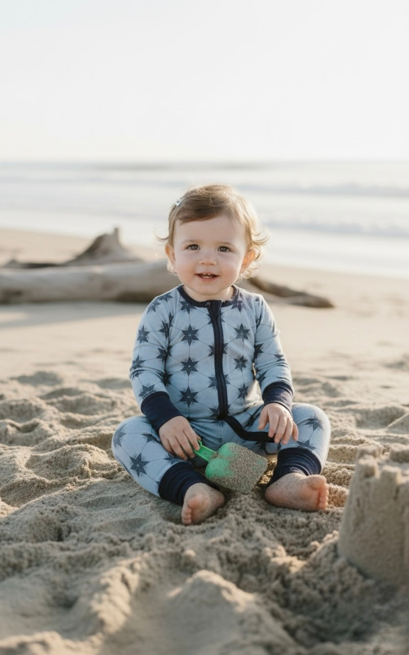 Starry Night Polar Blue bamboo baby romper by Shae & Palmer with star print on soft blue fabric, ultra-soft breathable material, double zipper design