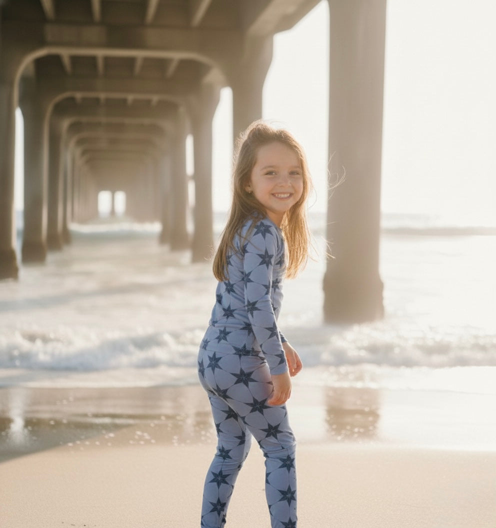 Big kid wearing Starry Night Polar Blue bamboo pajamas by Shae & Palmer, ultra-soft and breathable two-piece set in a cool blue tone, gentle on skin