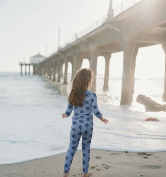 Toddler wearing Starry Night Polar Blue bamboo pajamas by Shae & Palmer, ultra-soft and breathable two-piece set in a soft blue tone, gentle on sensitive skin