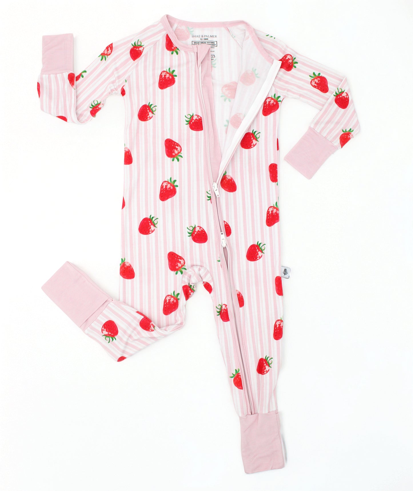 Baby romper in pink and white stripe with hand-painted strawberry print, long sleeve bamboo baby romper, flat lay with double zipper detail