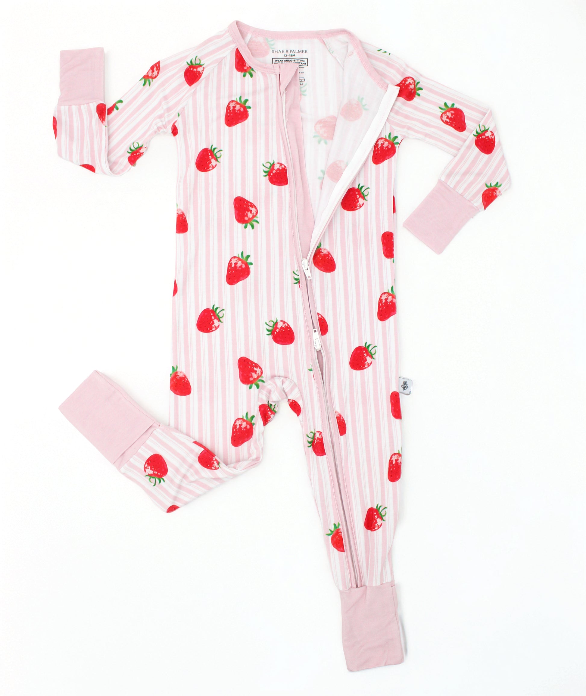 Baby romper in pink and white stripe with hand-painted strawberry print, long sleeve bamboo baby romper, flat lay with double zipper detail