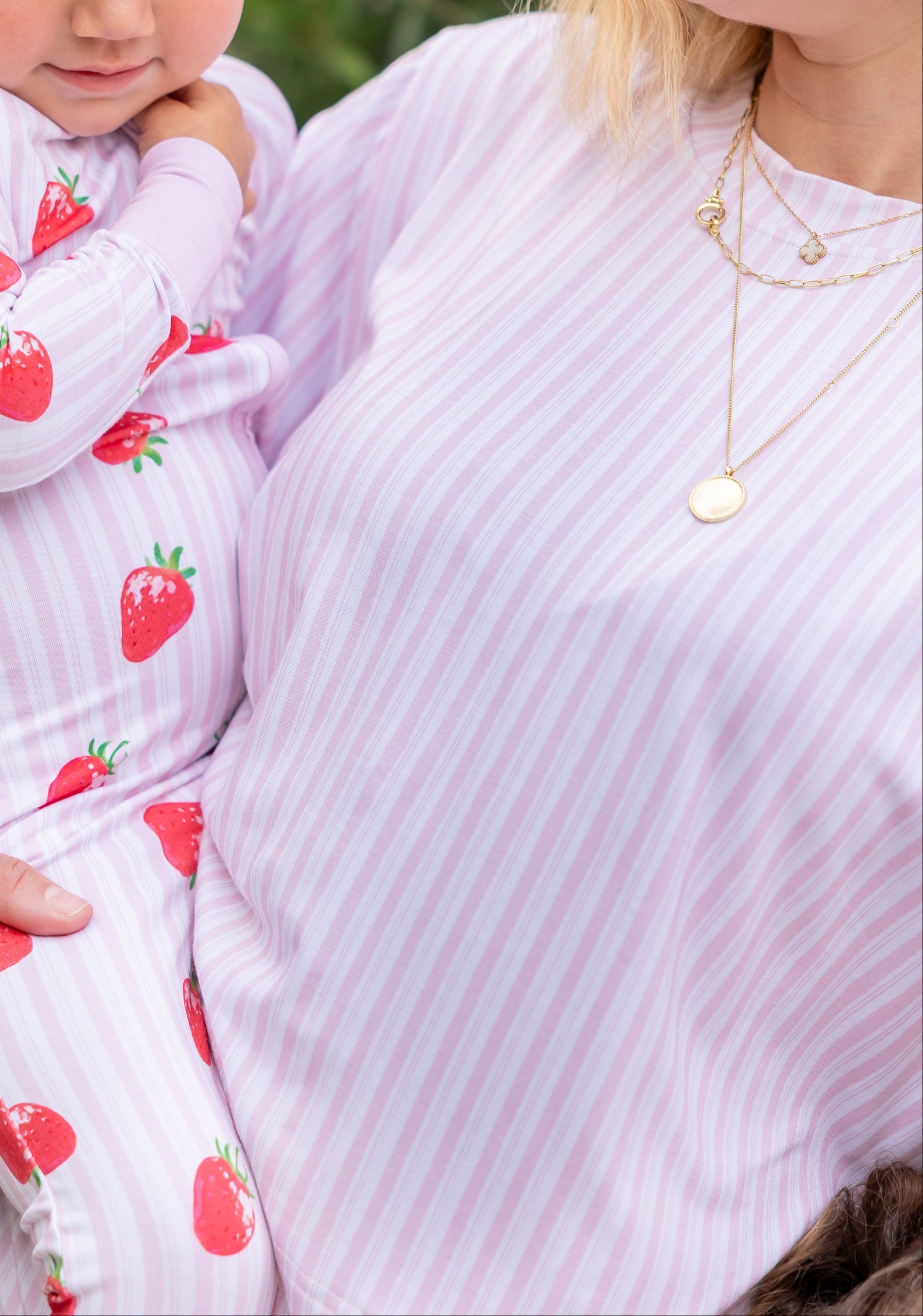 Mother and daughter in matching Strawberry Fields pink striped bamboo pajamas, part of Shae & Palmer's mommy-and-me luxury sleepwear collection.