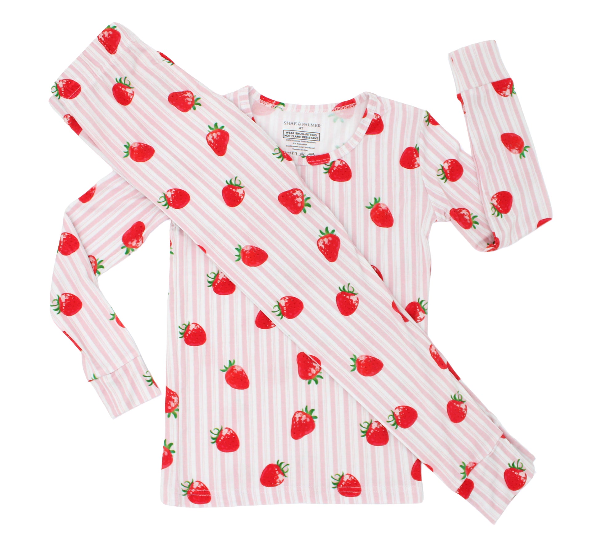 Strawberry Fields toddler pajama set flat lay, bamboo two-piece with strawberry print with vintage pink and white stripes