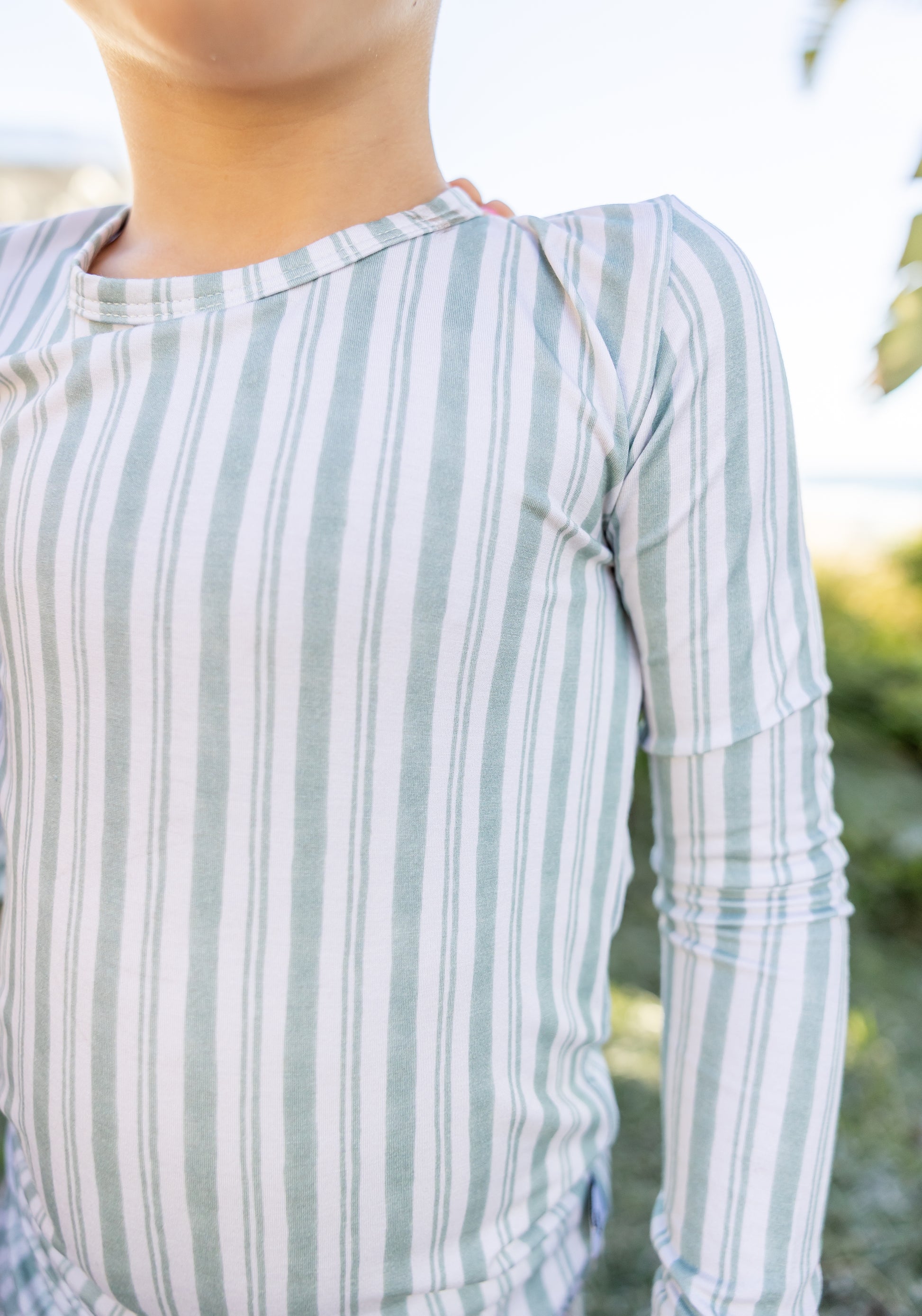 Shae & Palmer Studio Stripe Green Haze toddler pajama set featuring painterly green stripe detailing, stretchy bamboo fabric, and a cozy fitted two-piece design
