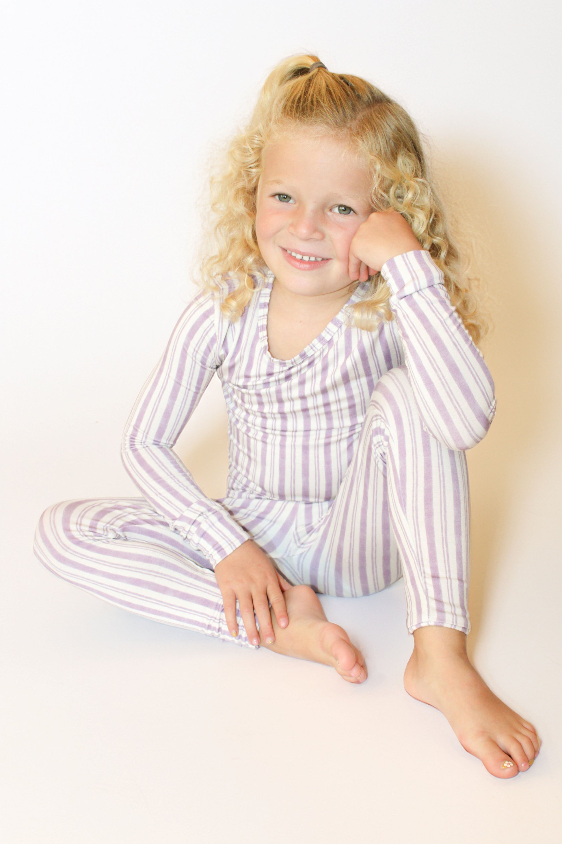 Shae & Palmer Studio Stripe Collection, bamboo toddler pajamas in Purple Haze. Ultra-soft, breathable two-piece pajama set for baby and toddler, perfect for cozy sleep and all-day play.