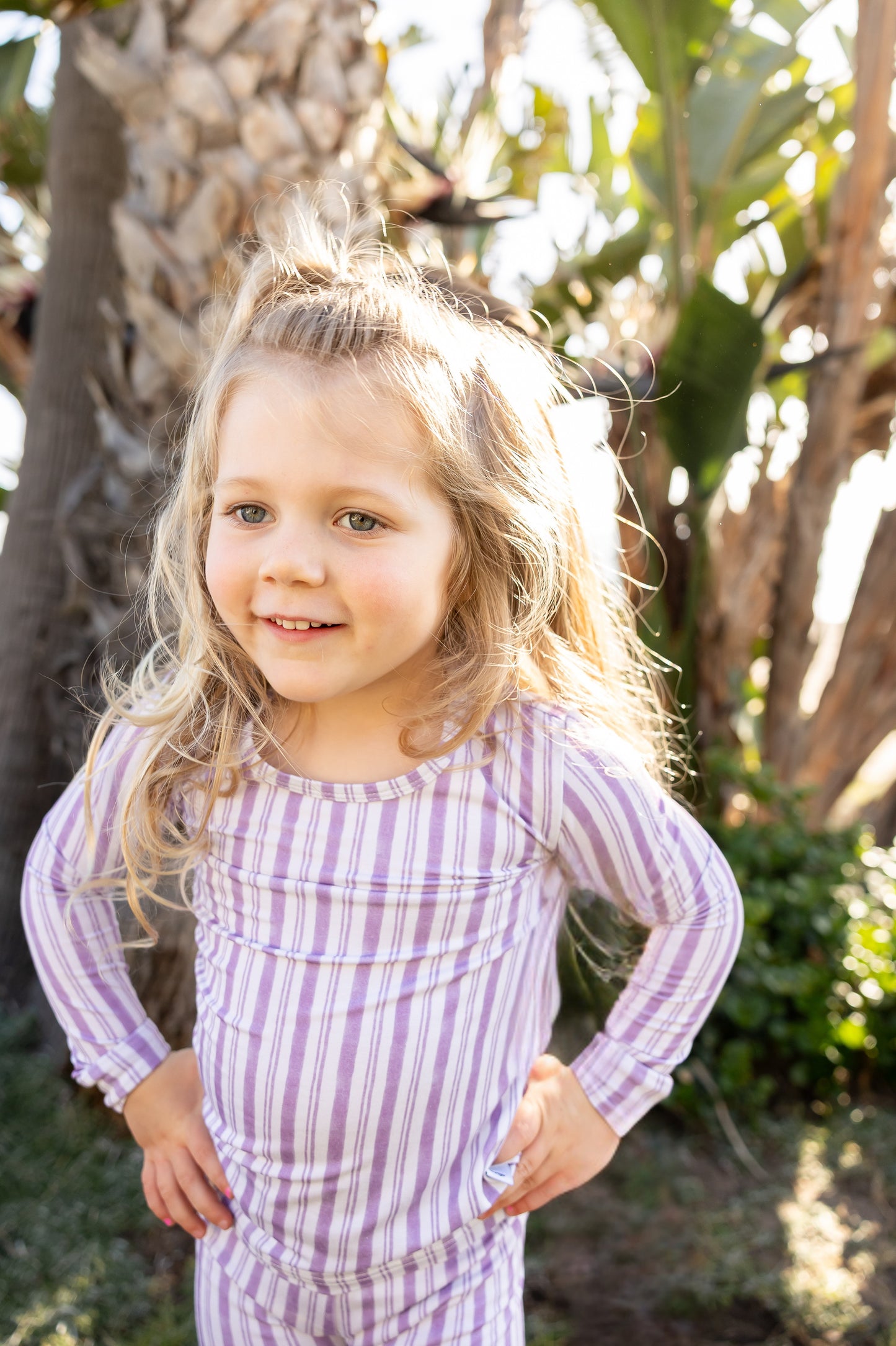 Toddler wearing Shae & Palmer Studio Stripe Purple Haze bamboo pajamas featuring muted purple painterly stripes, ultra-soft breathable bamboo fabric, and a cozy two-piece design for sleep and play.