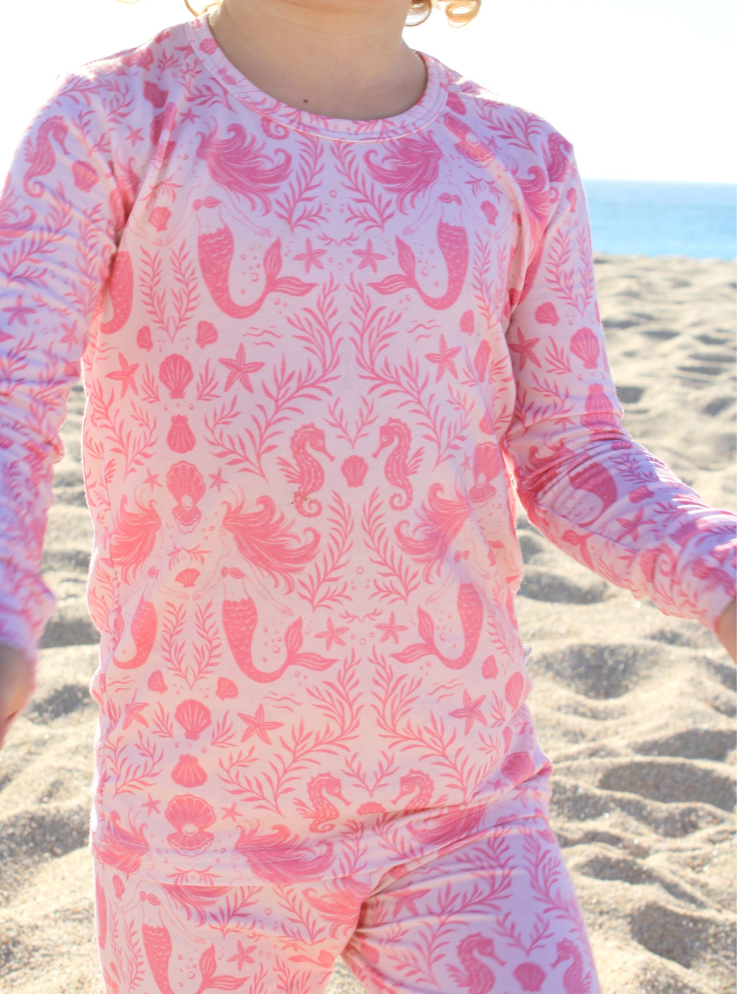 Shae & Palmer coastal-inspired toddler pajamas in blush mermaid pattern, modern and design-forward.