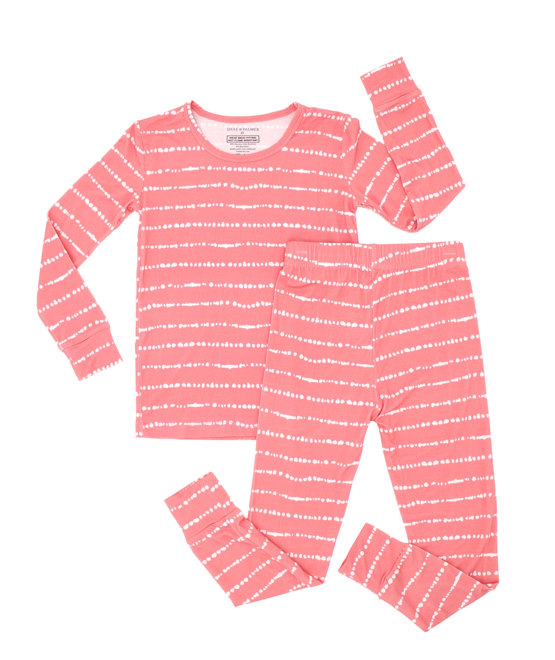 Watermelon Blush Stripe bamboo toddler pajamas laid flat with a long-sleeve top and matching pants in soft blush pink stripes.
