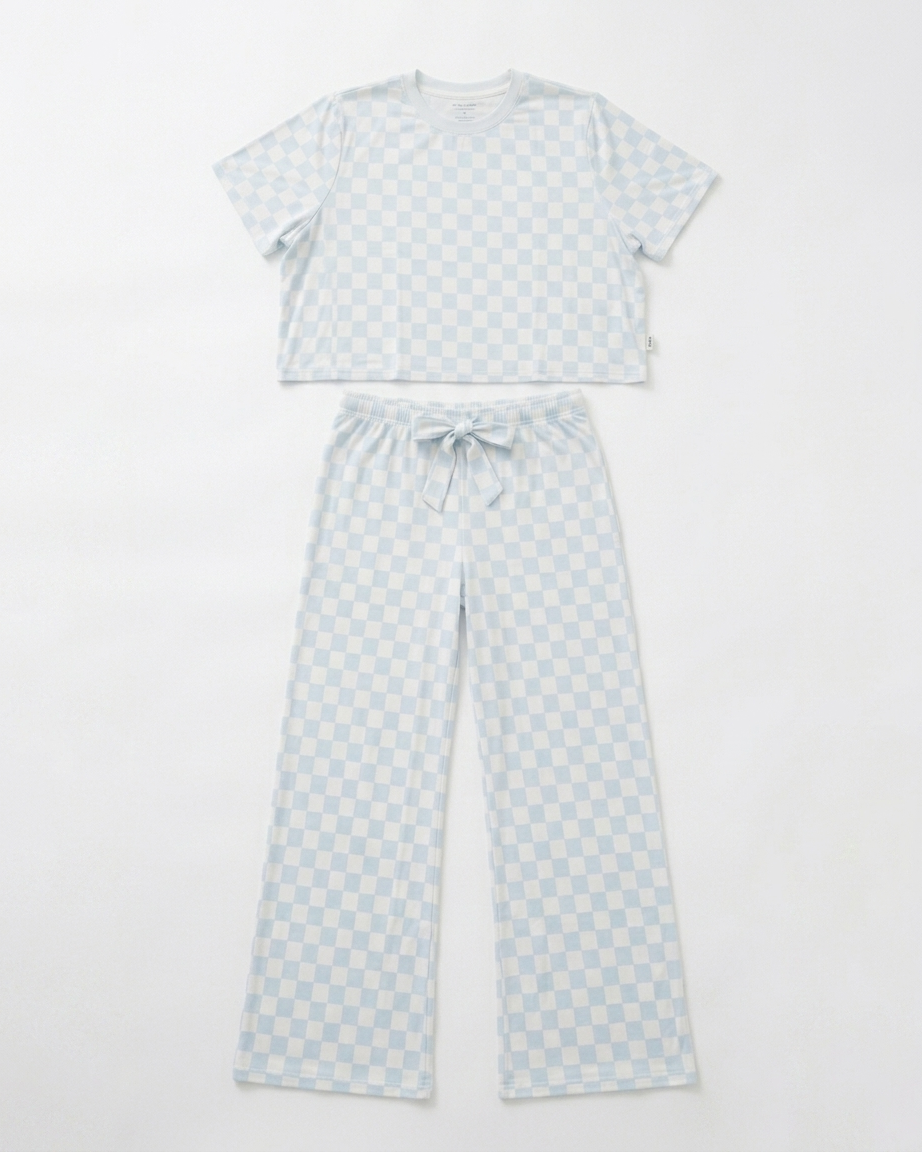 Woman wearing blue checkered bamboo pajama set with relaxed cropped top and matching pants front view