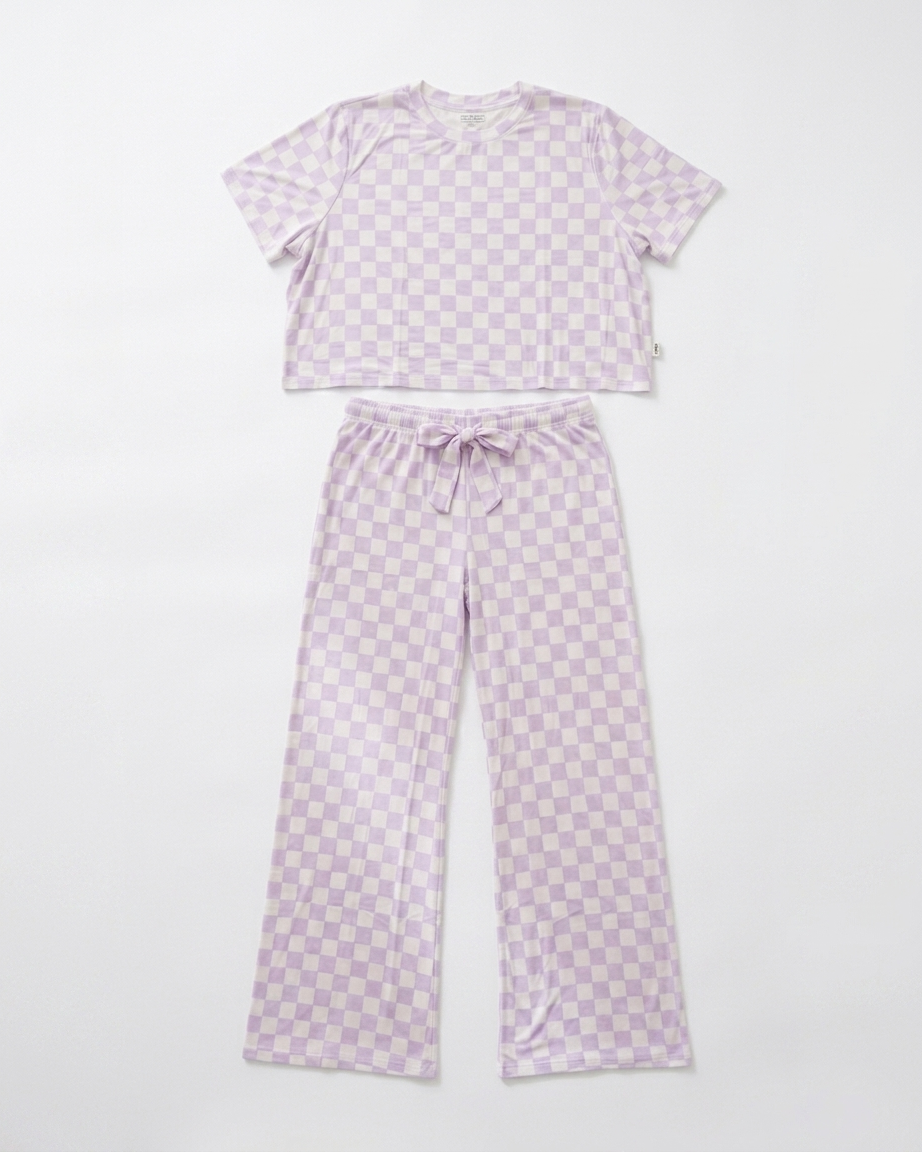 Woman wearing lavender checkered bamboo pajama set with relaxed cropped top and matching pants front view